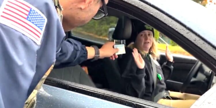 "I'm just a mom," an Oregon agitator whined after a federal officer confronted her for aggressively following and trying to block vehicles during an immigration enforcement operation.