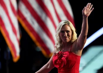 MILWAUKEE, WISCONSIN - JULY 15: U.S. Rep. Marjorie Taylor Greene (R-GA) waves on stage on the first day of the Republican National Convention at the Fiserv Forum on July 15, 2024 in Milwaukee, Wisconsin. Delegates, politicians, and the Republican faithful are in Milwaukee for the annual convention, concluding with former President Donald Trump accepting his party