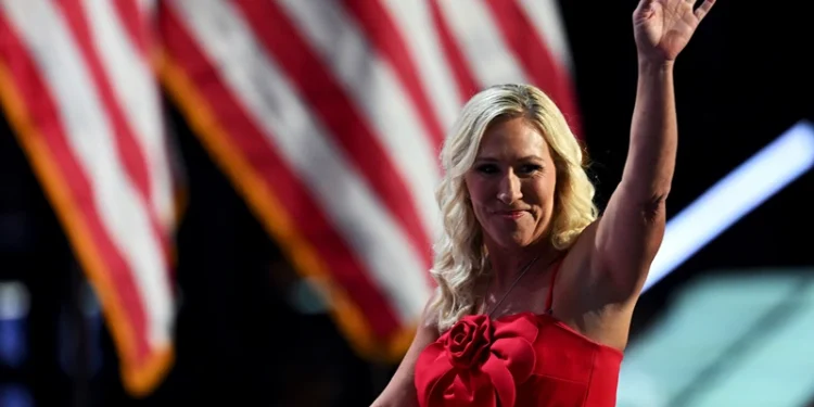 MILWAUKEE, WISCONSIN - JULY 15: U.S. Rep. Marjorie Taylor Greene (R-GA) waves on stage on the first day of the Republican National Convention at the Fiserv Forum on July 15, 2024 in Milwaukee, Wisconsin. Delegates, politicians, and the Republican faithful are in Milwaukee for the annual convention, concluding with former President Donald Trump accepting his party