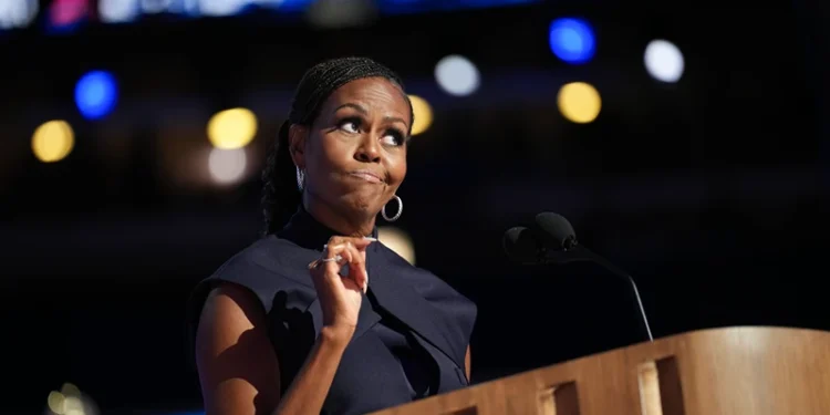 CHICAGO, ILLINOIS - AUGUST 20: Former first lady Michelle Obama speaks on stage during the second day of the Democratic National Convention at the United Center on August 20, 2024 in Chicago, Illinois. Delegates, politicians, and Democratic Party supporters are gathering in Chicago, as current Vice President Kamala Harris is named her party