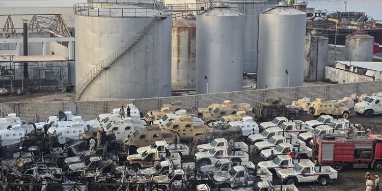 A photograph shows damaged military vehicles, reportedly sent by the United Arab Emirates to support Southern Transitional Council (STC) separatist forces, following an air strike carried out by the Saudi-led coalition in the port of Mukalla, southern Yemen, on December 30, 2025. Saudi Arabia on December 30 called the UAE