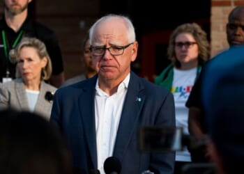 Minnesota Gov. Tim Walz speaks to journalists at Deerwood Elementary in Eagan, Minnesota, on Sept. 2, 2025.