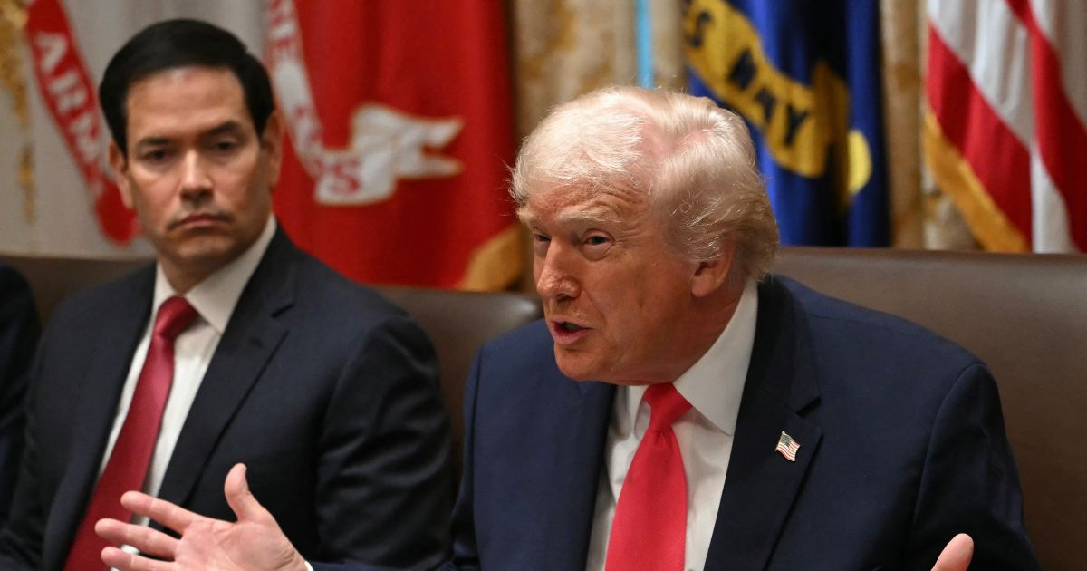 President Donald Trump speaks next to Secretary of State Marco Rubio during a meeting in the Cabinet Room of the White House on Dec. 2, 2025.