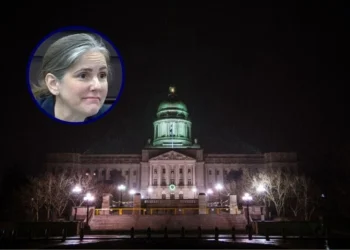 (Background) FRANKFORT, KY - JANUARY 16: The Capitol Building is seen at night during a snowstorm on January 16, 2021 in Frankfort, Kentucky. Supporters of President Trump are at state capitol buildings throughout the nation to protest the presidential election results and the upcoming inauguration of President-elect Joe Biden. (Photo by Jon Cherry/Getty Images) / (L) photo of Rep. Sarah Stock (D-Ky.) from the official Legislative Research Commission livestream