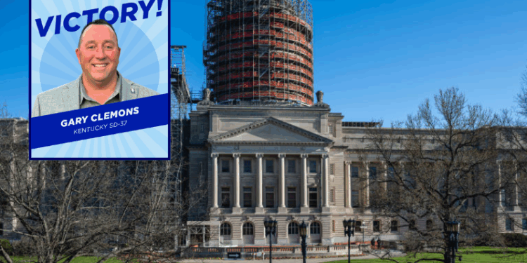 (Background) People, many of whom are adolescents, gather during a rally to protest the passing of SB 150 on March 29, 2023 at the Kentucky State Capitol in Frankfort, Kentucky. SB 150, which was proposed by State Senator Max Wise (R-KY), is criticized by many as a "Don