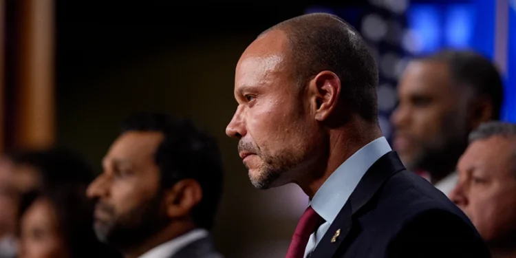 WASHINGTON, DC - DECEMBER 4: FBI Deputy Director Dan Bongino (C) attends a news conference on an arrest of a suspect in the January 6th pipe bombing case at the Department of Justice on December 4, 2025 in Washington, DC. Federal agents have arrested a suspect they are charging with placing two pipe bombs, which never exploded, the night before the January 6th, 2021 U.S. Capitol attack. (Photo by Andrew Harnik/Getty Images)