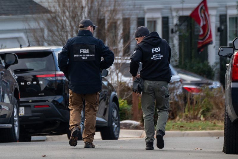 WOODBRIDGE, VIRGINIA - DECEMBER 4: FBI agents gather in front of the home of suspected January 6th, 2021 pipe bomber on December 4, 2025 in Woodbridge, Virginia. Federal agents have arrested a suspect identified as Brian Cole they are alleging placed two pipe bombs, which never exploded, the night before the January 6th, 2021 U.S. Capitol attack. (Photo by Andrew Leyden/Getty Images)
