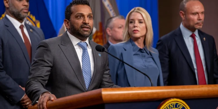 FBI Director Kash Patel (2L) speaks alongside Attorney General Pam Bondi (C) and Deputy FBI Director Dan Bongino (R) during a news conference at the Department of Justice to discuss the arrest of man in connection with pipe bombs placed near the Democratic and Republican party headquarters on the eve of the January 6, 2021 US Capitol riot, in Washington, DC, on December 4, 2025. (Photo by DANIEL HEUER / AFP via Getty Images)