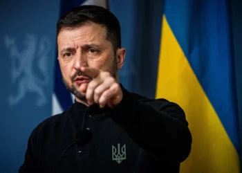 Ukrainian President Volodymyr Zelensky gestures as he addresses a press conference with the Norwegian Prime Minister in the government