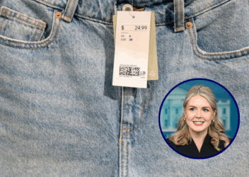 (Background) A price tag is seen on jean shorts in a clothing store in Washington, DC, on June 14, 2022. (Photo by Stefani Reynolds / AFP) (Photo by STEFANI REYNOLDS/AFP via Getty Images) / (R) White House Press Secretary Karoline Leavitt speaks during the press briefing in the Brady Briefing Room of the White House in Washington, DC, on December 11, 2025. (Photo by Jim WATSON / AFP via Getty Images)