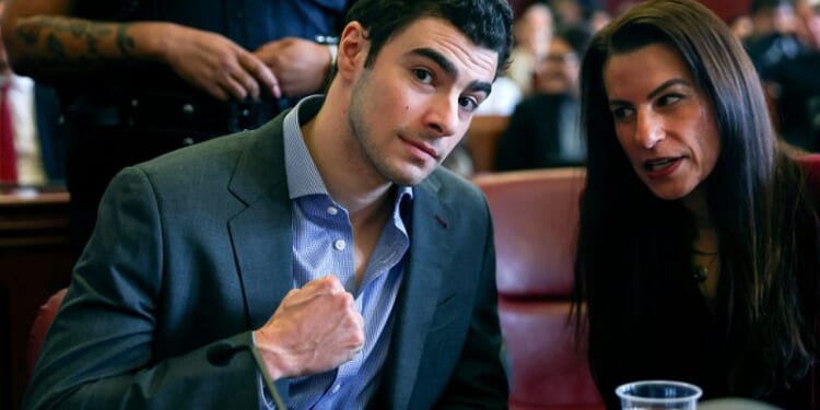 Mangione confidently ‘fist pumps’ as defense team challenges admissibility of evidence from arrest – One America News Network