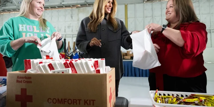 Melania, Usha and other Trump admin. spouses join U.S. military spouses in crafting care packages for service members at Joint Base Andrews