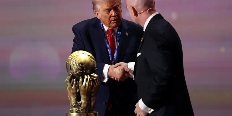 WASHINGTON, DC - DECEMBER 05: U.S. President Donald Trump receives the FIFA Peace Prize from Gianni Infantino, President of FIFA, during the FIFA World Cup 2026 Official Draw at John F. Kennedy Center for the Performing Arts on December 05, 2025 in Washington, DC. (Photo by Patrick Smith/Getty Images)