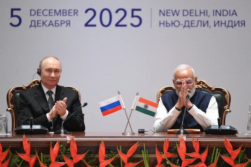 In this pool photograph distributed by the Russian state agency Sputnik, Russia's President Vladimir Putin and India's Prime Minister Narendra Modi attend a plenary session of the India-Russia trade forum in New Delhi on December 5, 2025. (Photo by Grigory SYSOYEV / POOL / AFP via Getty Images) / ***Editor's note : this image is distributed by the Russian state owned agency Sputnik***