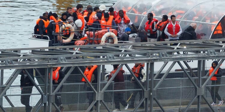 The U.K. Border Force vessel brings migrants who were intercepted crossing the English Channel into Dover port on Oct. 8, 2025, in Dover, England.