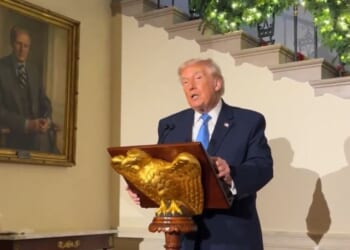 President Donald Trump paused to pay tribute to the National Guard members shot last week.