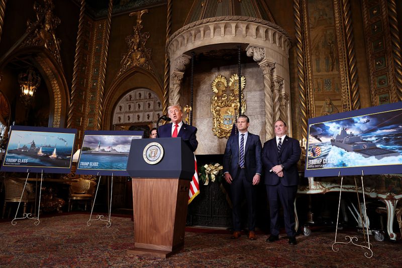PALM BEACH, FLORIDA - DECEMBER 22: U.S. President Donald Trump, joined by Secretary of State Marco Rubio (L), Secretary of War Pete Hegseth, and Secretary of the Navy John Phelan, announced the creation of the “Trump-class” battleship during a statement to the media at Trump’s Mar-a-Lago estate on December 22, 2025 in Palm Beach, Florida. Trump announced the new class of ship will become the centerpiece of his “Golden Fleet” program to rebuild and strengthen the U.S. shipbuilding industry. (Photo by Tasos Katopodis/Getty Images)