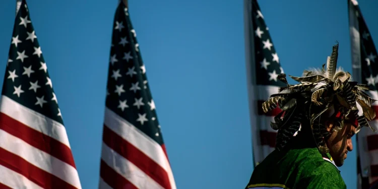 LUMBERTON, NC - OCTOBER 24: People attend a campaign rally for President Donald Trump on October 24, 2020 in Lumberton, North Carolina. President Trump has expressed his support for the Lumbee Indian people to be recognized on a federal level. President Trump continues to campaign against Democratic presidential nominee Joe Biden leading up to the November 3rd Election Day. (Photo by Melissa Sue Gerrits/Getty Images)