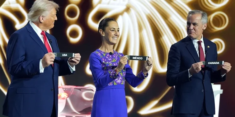 WASHINGTON, DC - DECEMBER 05: U.S. President Donald Trump, Claudia Sheinbaum, President of Mexico, and Mark Carney, Prime Minister of Canada, show the draw on stage during the FIFA World Cup 2026 Official Draw at John F. Kennedy Center for the Performing Arts on December 05, 2025 in Washington, DC. (Photo by Stephanie Scarbrough - Pool/Getty Images)