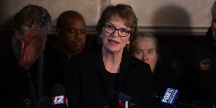 Brown University President Christina Paxson answers journalists' questions during a news conference after a shooting occurred on campus in Providence, Rhode Island, on Dec. 13, 2025.