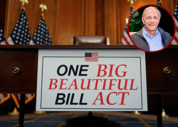 (R)Ray Dalio is interviewed by host Nicole Lapin on the "Money Rehab" podcast on May 15, 2025 in New York City. (Photo by Roy Rochlin/Getty Images for Nicole Lapin) / (Background) A sign that reads "One Big Beautiful Bill Act" is seen by a desk after the the House of Representatives passed the US President Donald Trump