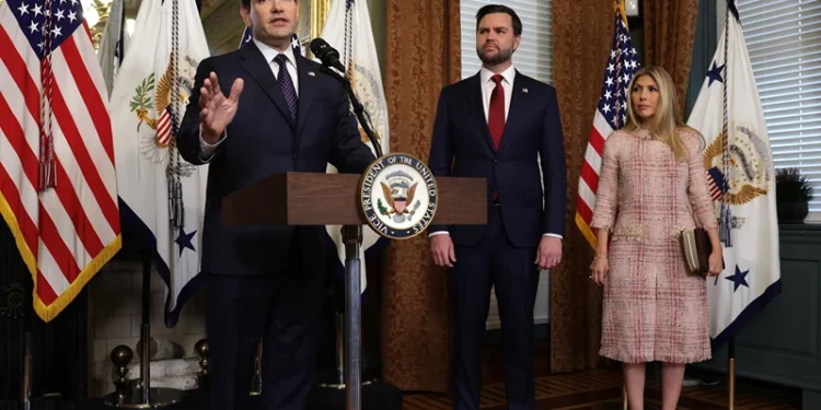 WASHINGTON, DC - JANUARY 21: Former U.S. Sen. Marco Rubio (R-FL) (L) speaks as Vice President J.D. Vance (2nd L) as his wife Jeanette Dousdebes Rubio (R) listen during a swearing in ceremony at the Vice President’s ceremonial office at Eisenhower Executive Office Building January 21, 2025 in Washington, DC. Rubio has been sworn in as the 72nd U.S. Secretary of State. (Photo by Alex Wong/Getty Images)