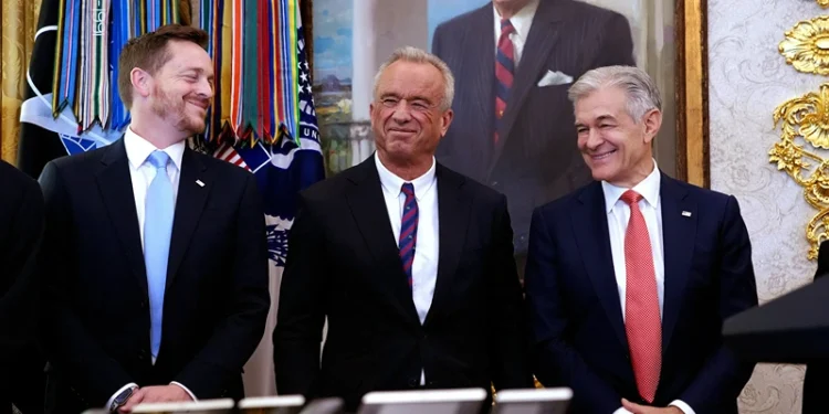 WASHINGTON, DC - NOVEMBER 06: Director of Medicare and Deputy Administrator of CMS Chris Comp (L), Health and Human Services Secretary Robert F. Kennedy Jr., and Administrator for the Centers for Medicare & Medicaid Services Dr. Mehmet Oz stand together while President Donald Trump delivers remarks on lowering drug prices in the Oval Office at the White House on November 06, 2025 in Washington, DC. Trump announced that his administration has reached agreements with drugmakers Eli Lilly and Novo Nordisk that would lower the price of some GLP-1 weight loss medications. (Photo by Andrew Harnik/Getty Images)