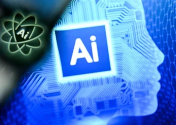 A photo taken on January 2, 2025 shows the letters AI for Artificial Intelligence on a laptop screen (R) next to the logo of the Chat AI application on a smartphone screen in Frankfurt am Main, western Germany. (Photo by Kirill KUDRYAVTSEV / AFP) (Photo by KIRILL KUDRYAVTSEV/AFP via Getty Images)