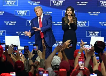 Former US President and Republican presidential candidate Donald Trump, with moderator and South Dakota Governor Kristi Noem (R), arrives for a town hall at the Greater Philadelphia Expo Center and Fairgrounds in Oaks, Pennsylvania, on October 14, 2024. (Photo by Jim WATSON / AFP) (Photo by JIM WATSON/AFP via Getty Images)