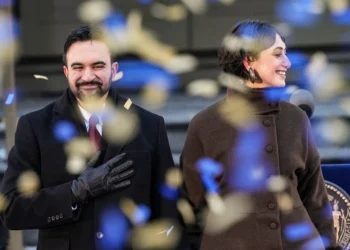 NEW YORK, NEW YORK - JANUARY 01: New York Mayor Zohran Mamdani and his wife Rama Duwaji smile as confetti falls after his ceremonial inauguration as mayor at City Hall Thursday January 1, 2026 in New York, NY. Mamdani has added a “block party” to the official inauguration events to allow thousands of New Yorkers to take part. Mamdani was officially sworn in at midnight by New York Attorney General Letitia James at the Old City Hall subway station in a private ceremony. (Photo by David Dee Delgado/Getty Images)