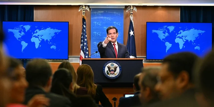 US Secretary of State Marco Rubio points as journalists raise their hands to ask questions during an end-of-year press conference in the State Department Press Briefing Room in Washington, DC on December 19, 2025. (Photo by Mandel NGAN / AFP via Getty Images)