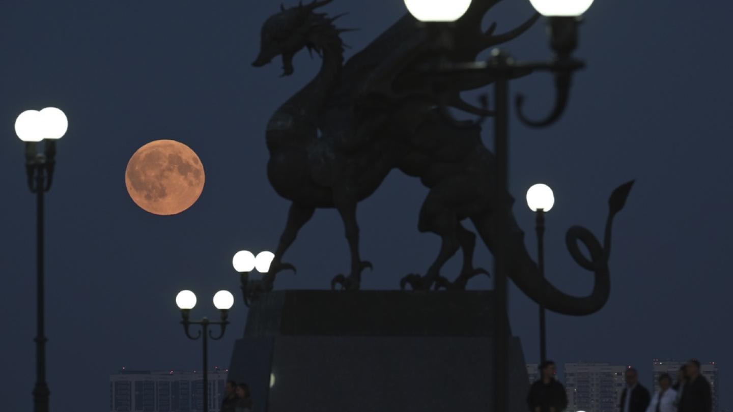 The full moon is seen before a total lunar eclipse in Kazan, Republic of Tatarstan, Russia. During totality, the Moon turned a reddish color, also known as a Blood Moon. Maksim Bogodvid / Sputnik via AP