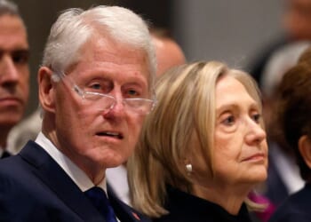 Bill and Hillary Clinton sit and look on at the funeral service of former Labor Secretary Alexis Herman at the National Cathedral on May 14, 2025 in Washington, DC.