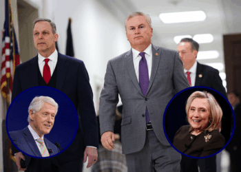 (Background) House Oversight and Government Reform Committee Chairman James Comer (R-KY) and Rep. Scott Perry (R-PA) walk in the hallway after former Secretary of State Hillary Clinton failed to appear for a closed-door deposition in the Rayburn House Office Building on Capitol Hill on January 14, 2026 in Washington, DC. Comer said the committee will vote next week to hold Hillary Clinton and her husband former President Bill Clinton in contempt of Congress for not testifying as part of the committee