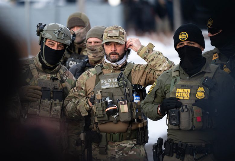 MINNEAPOLIS, MINNESOTA - JANUARY 10: Federal agents stage at a front gate as Rep. Ilhan Omar (D-MN), Rep. Kelly Morrison (D-MN), and Rep. Angie Craig (D-MN) attempt to enter the regional ICE headquarters at the Bishop Henry Whipple Federal Building on January 10, 2026 in Minneapolis, Minnesota. The Congresspeople were briefly allowed access to the facility where the Department of Homeland Security has been headquartering operations in the state. (Photo by Stephen Maturen/Getty Images)