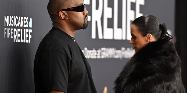 US rapper and producer Kanye West (L) and Australian model Bianca Censori arrive for the 67th Annual Grammy Awards at the Crypto.com Arena in Los Angeles on February 2, 2025. (Photo by Robyn Beck / AFP) / RESTRICTED TO EDITORIAL USE (Photo by ROBYN BECK/AFP via Getty Images)