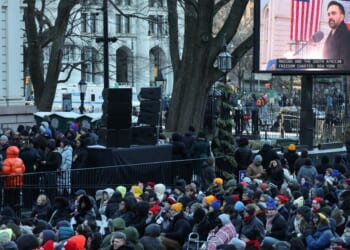 New York mayor Zohran Mamdani is seen on a screen as he speaks during his public inauguration ceremony followed by a block party at City Hall in New York on January 1, 2026.
