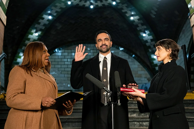 NEW YORK, NEW YORK - JANUARY 1: Zohran Mamdani is sworn in as New York City's 112th mayor by New York Attorney General Letitia James, left, alongside his wife Rama Duwaji, right, in the former City Hall subway station on January 1, 2026 in New York City. Mamdani’s term as mayor begins immediately in the new year, and a public inauguration will also take place in the afternoon at City Hall. (Photo by Amir Hamja-Pool/Getty Images)