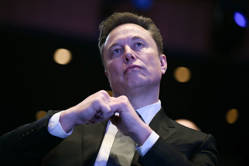 Elon Musk looks on as US President Donald Trump speaks at the US-Saudi Investment Forum at the John F. Kennedy Center for the Performing Arts in Washington, DC on November 19, 2025. (Photo by Brendan SMIALOWSKI / AFP) (Photo by BRENDAN SMIALOWSKI/AFP via Getty Images)