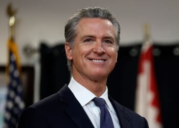 SAN FRANCISCO, CALIFORNIA - JANUARY 16: California Gov. Gavin Newsom looks on during a press conference at Friendship House Association of American Indians on January 16, 2026 in San Francisco, California. California Gov. Gavin Newsom joined San Francisco Mayor Daniel Lurie to announce new funding for homelessness and mental health efforts in the city of San Francisco. The governor announced more than $420 million in new state funding for San Francisco, Los Angeles, and San Diego as part of the state