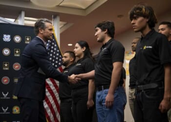 War Secretary Pete Hegseth greets recruits at a swearing-in ceremony at the Los Angeles Military Entrance Processing Station on January 9, 2026. (via: U.S. Department of War)