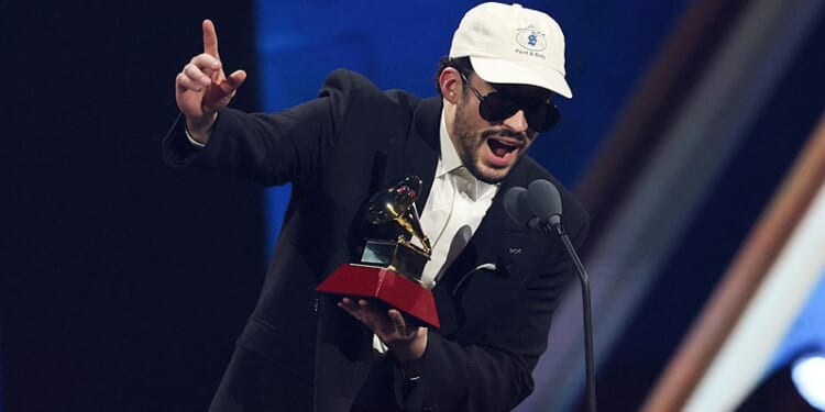 TOPSHOT - Puerto Rican singer Bad Bunny accepts the Album of the Year award for "DeBI TIRAR MaS FOToS" during the 26th Annual Latin Grammy Awards at the MGM Grand Garden Arena in Las Vegas, Nevada on November 13, 2025. (Photo by VALERIE MACON / AFP) / RESTRICTED TO EDITORIAL USE (Photo by VALERIE MACON/AFP via Getty Images)