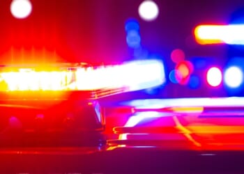 Red and blue flashing police lights at a crime scene.