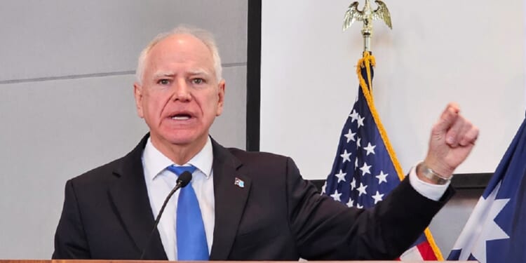 Minnesota Gov. Tim Walz gestures during a December news conference in St. Paul.