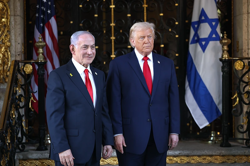 PALM BEACH, FLORIDA - DECEMBER 29: U.S. President Donald Trump welcomes Israeli Prime Minister Benjamin Netanyahu to his Mar-a-Lago club on December 29, 2025 in Palm Beach, Florida. The two leaders are scheduled to hold a bilateral meeting to discuss regional security in the Middle East as well as the U.S.-Israel partnership. (Photo by Joe Raedle/Getty Images)