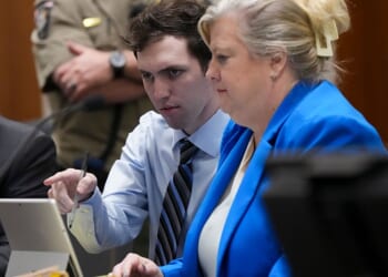 PROVO, UTAH - JANUARY 16: Tyler Robinson, left, accused in the fatal shooting of Charlie Kirk, points with defense attorney Kathryn Nester during a hearing in 4th District Court on January 16, 2026 in Provo, Utah. Prosecutors have charged Tyler Robinson with aggravated murder and plan to seek the death penalty. (Photo by Bethany Baker-Pool/Getty Images)