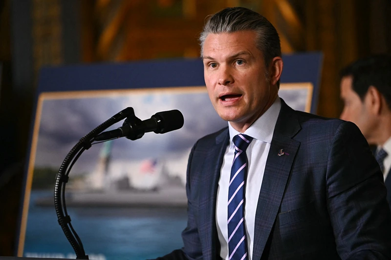 Defense Secretary Pete Hegseth speaks about the US Navy's new Golden Fleet initiative, unveiling a new class of warships, at Mar-a-Lago in Palm Beach, Florida, on December 22, 2025. President Donald Trump on December 22 announced a new class of heavily armed warships that will be named after himself -- an honor usually reserved for US leaders who have left office.Two of the Trump-class ships will be built initially but that number could grow substantially in the future, according to the president, who said they will be "some of the most lethal surface warfare ships" and "the largest battleship in the history of our country."Trump made the announcement at his Mar-a-Lago residence in Florida alongside Pentagon chief Pete Hegseth, Secretary of State Marco Rubio and Navy Secretary John Phelan, with images of the planned high-tech vessels on stands nearby. (Photo by ANDREW CABALLERO-REYNOLDS / AFP via Getty Images)