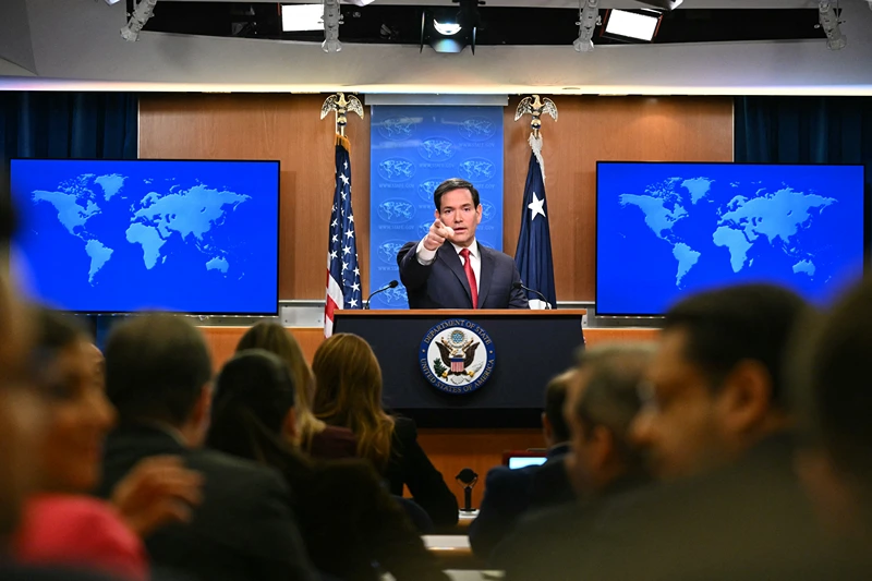US Secretary of State Marco Rubio points as journalists raise their hands to ask questions during an end-of-year press conference in the State Department Press Briefing Room in Washington, DC on December 19, 2025. (Photo by Mandel NGAN / AFP via Getty Images)