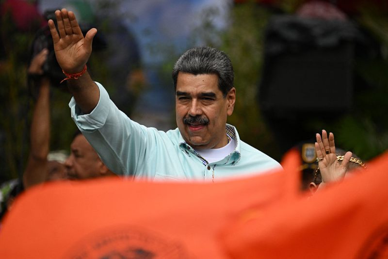 TOPSHOT - Venezuela's President Nicolas Maduro gestures during a rally to mark the anniversary of the Battle of Santa Ines, in Caracas on December 10, 2025. (Photo by Federico PARRA / AFP via Getty Images)