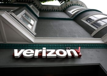 SAN FRANCISCO, CALIFORNIA - NOVEMBER 13: A sign is posted in front of a Verizon store on November 13, 2025 in San Francisco, California. Verizon has announced plans to cut an estimated 15% of its workforce, or 15,000 jobs, as part of a restructuring plan under its new CEO Dan Schulman. (Photo by Justin Sullivan/Getty Images)